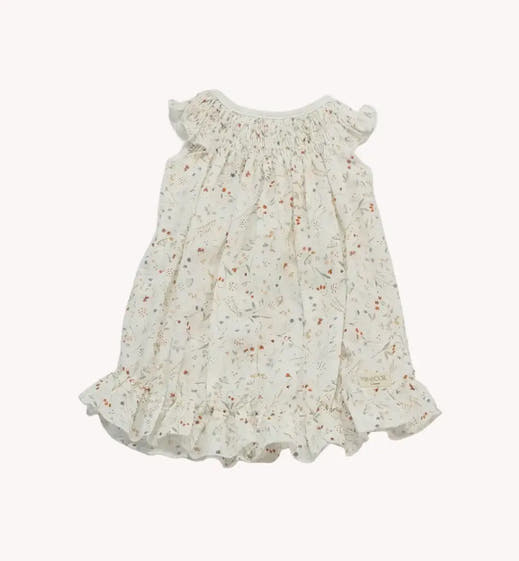 Vestido de bebé Botánico Acuarela com estampado vegetal e folhos nos ombros e na bainha.