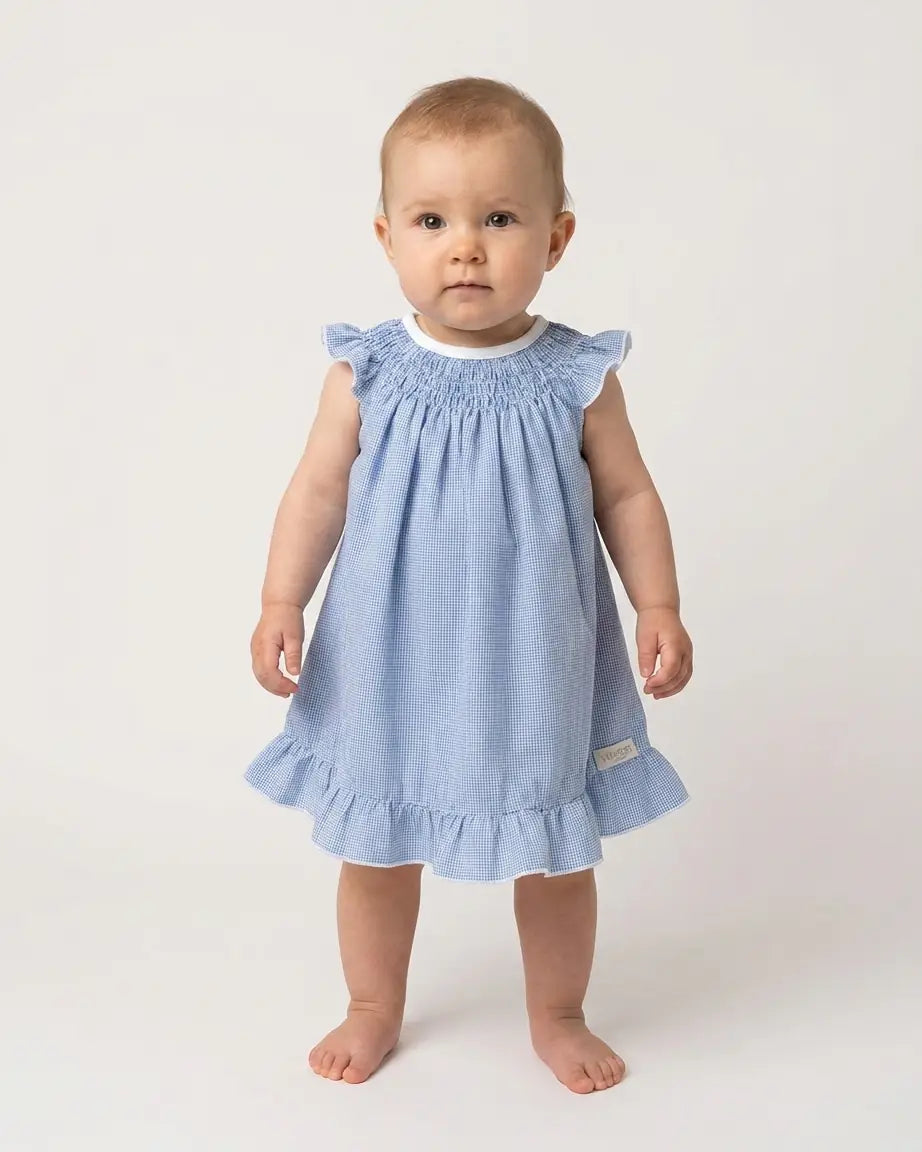 Conjunto de bebé de vestido con alas de ángel y bombacha de pata de gallo azul de Yvicor Atelier de Costura.