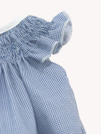 Conjunto de bebé de vestido con alas de ángel y bombacha pata de gallo azul, de Yvicor Atelier de Costura, para bebé.