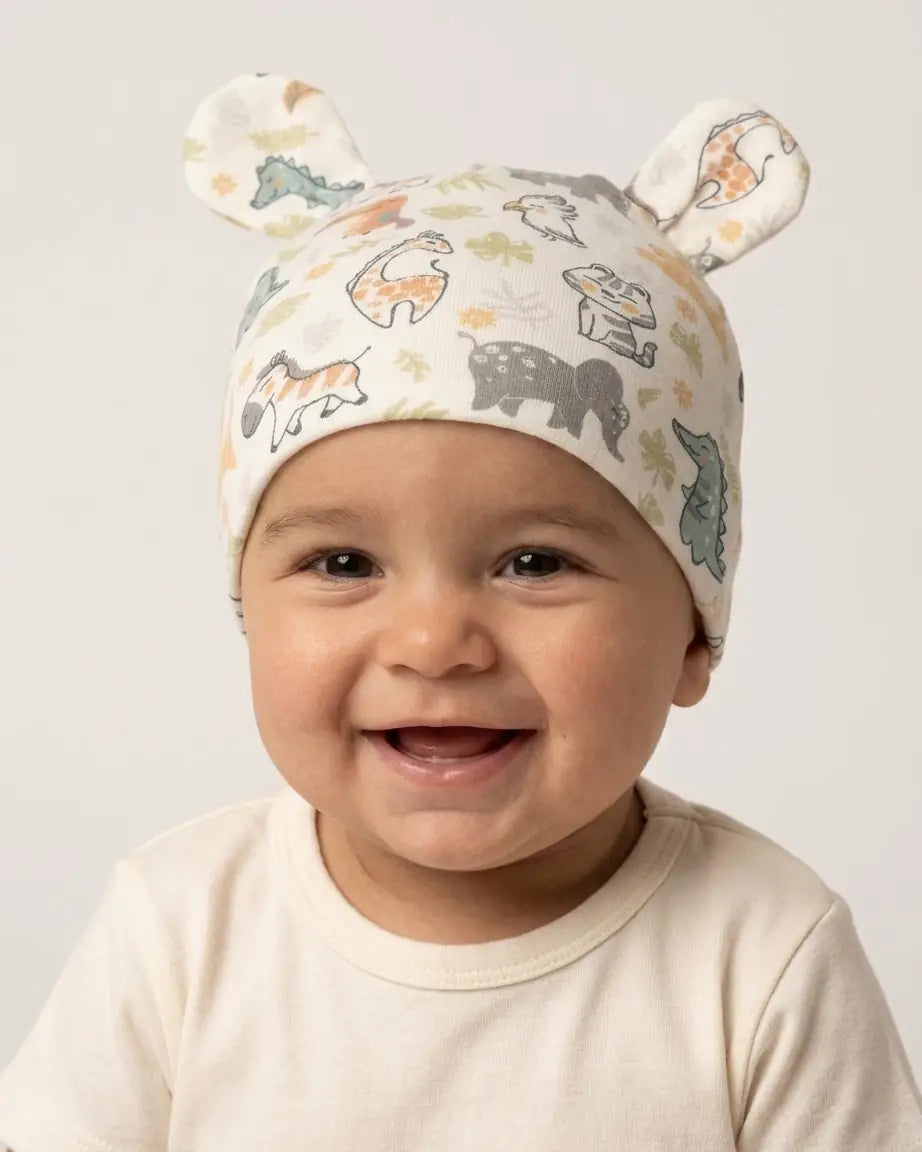 Gorrito reversible para bebé con orejas, estampado safari y marrón liso, de Yvicor Atelier de Costura (vista 2).